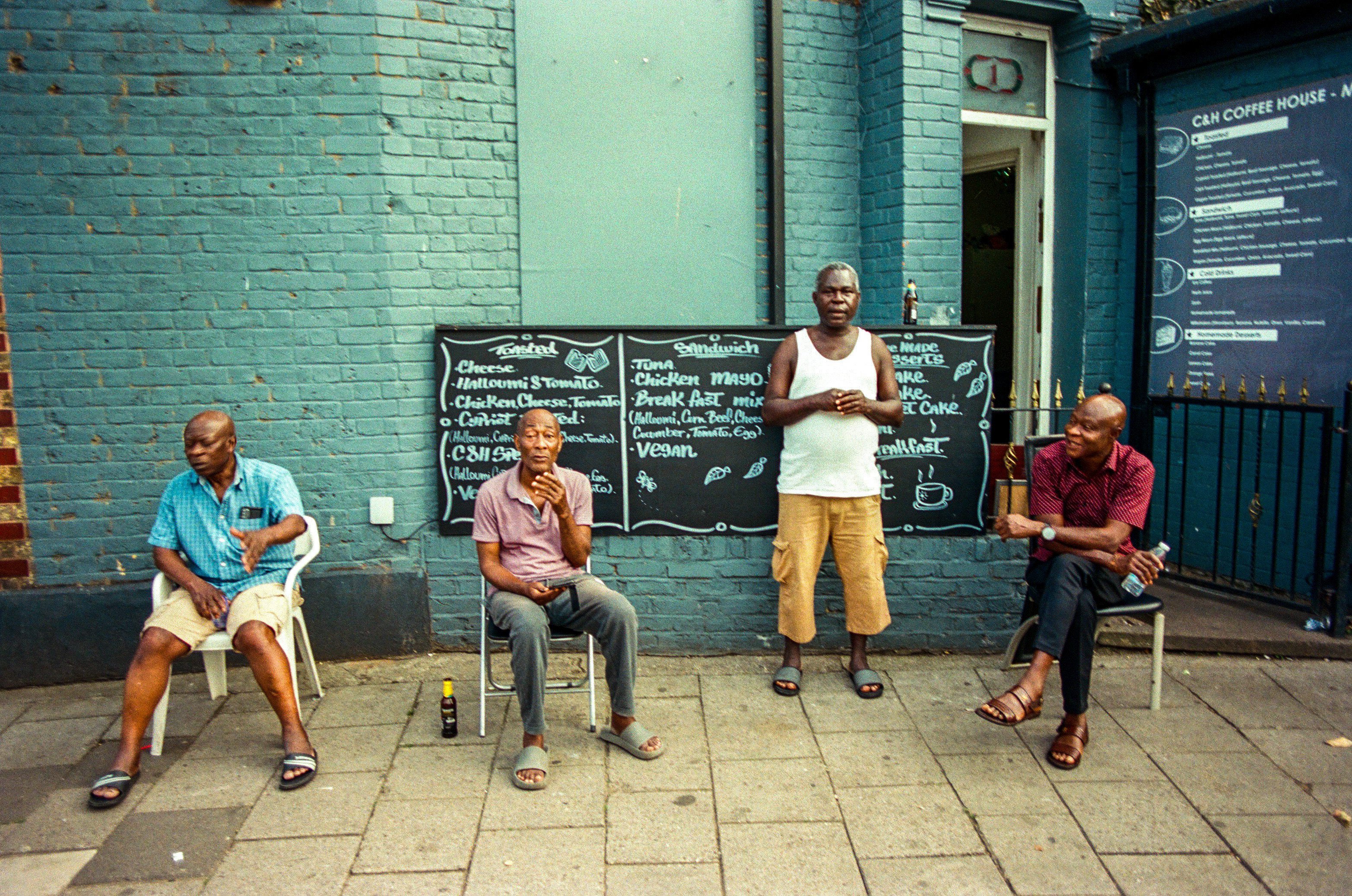 Four men outside a neighborhood coffee house